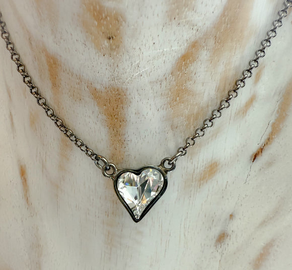 Clear Mini Heart in a Black Setting